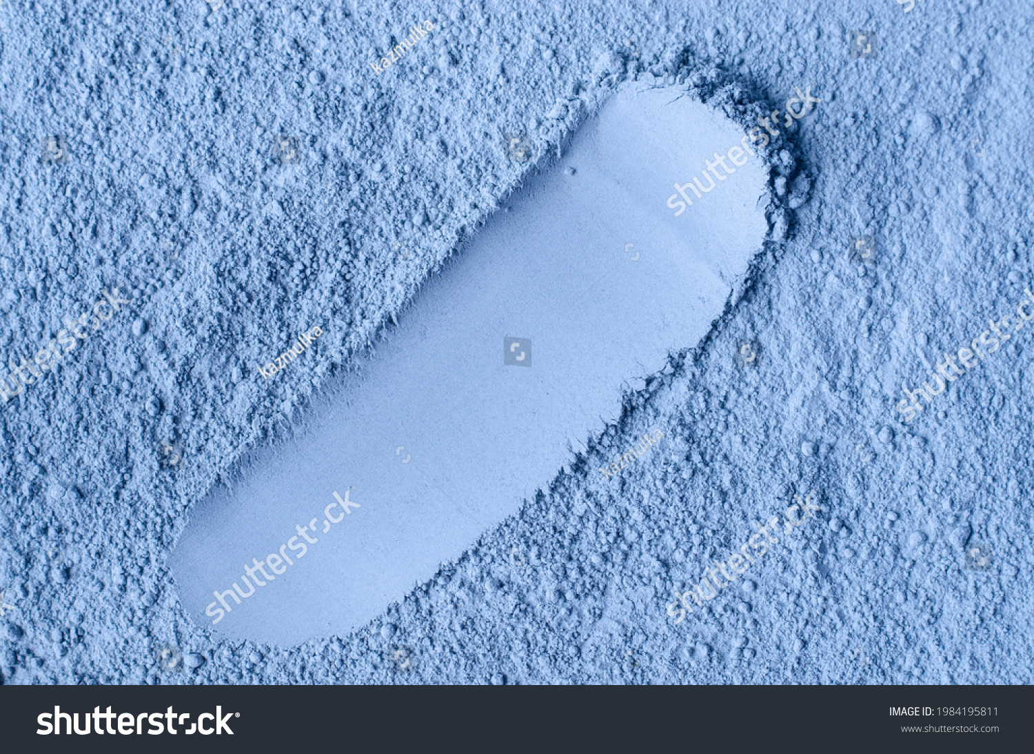 Light blue bentonite facial clay powder (alginate mask  body wrap) texture close up  selective focus. Abstract background with brush stroke. 