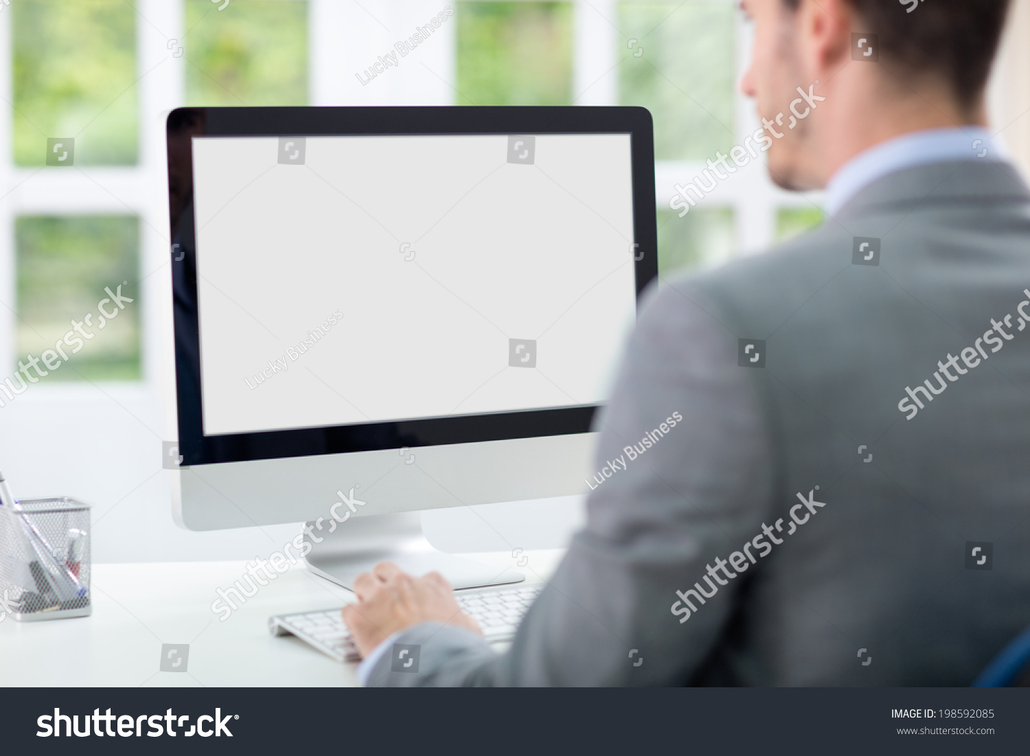 Businessman looking at computer screen