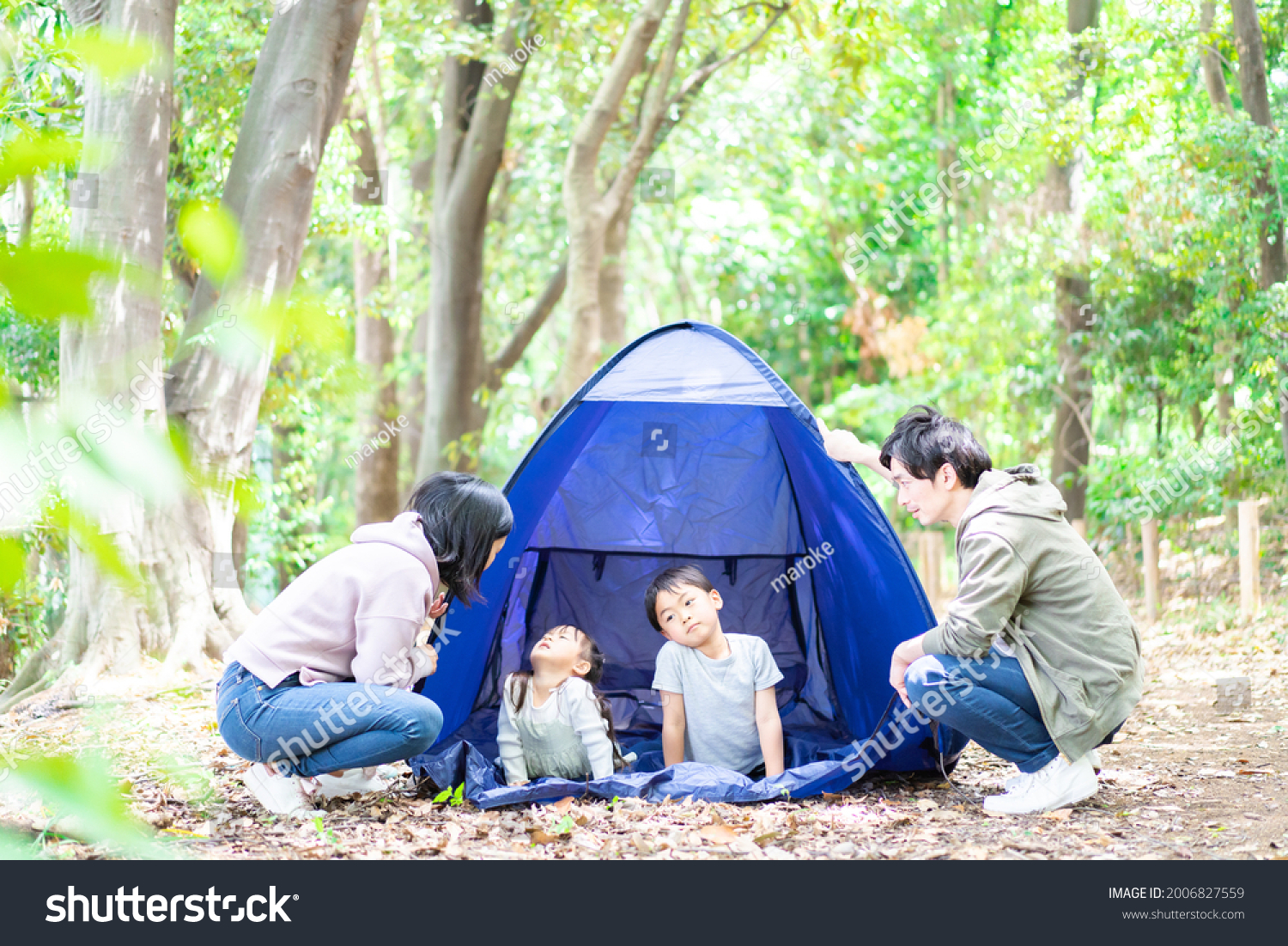 Family camping in the forest