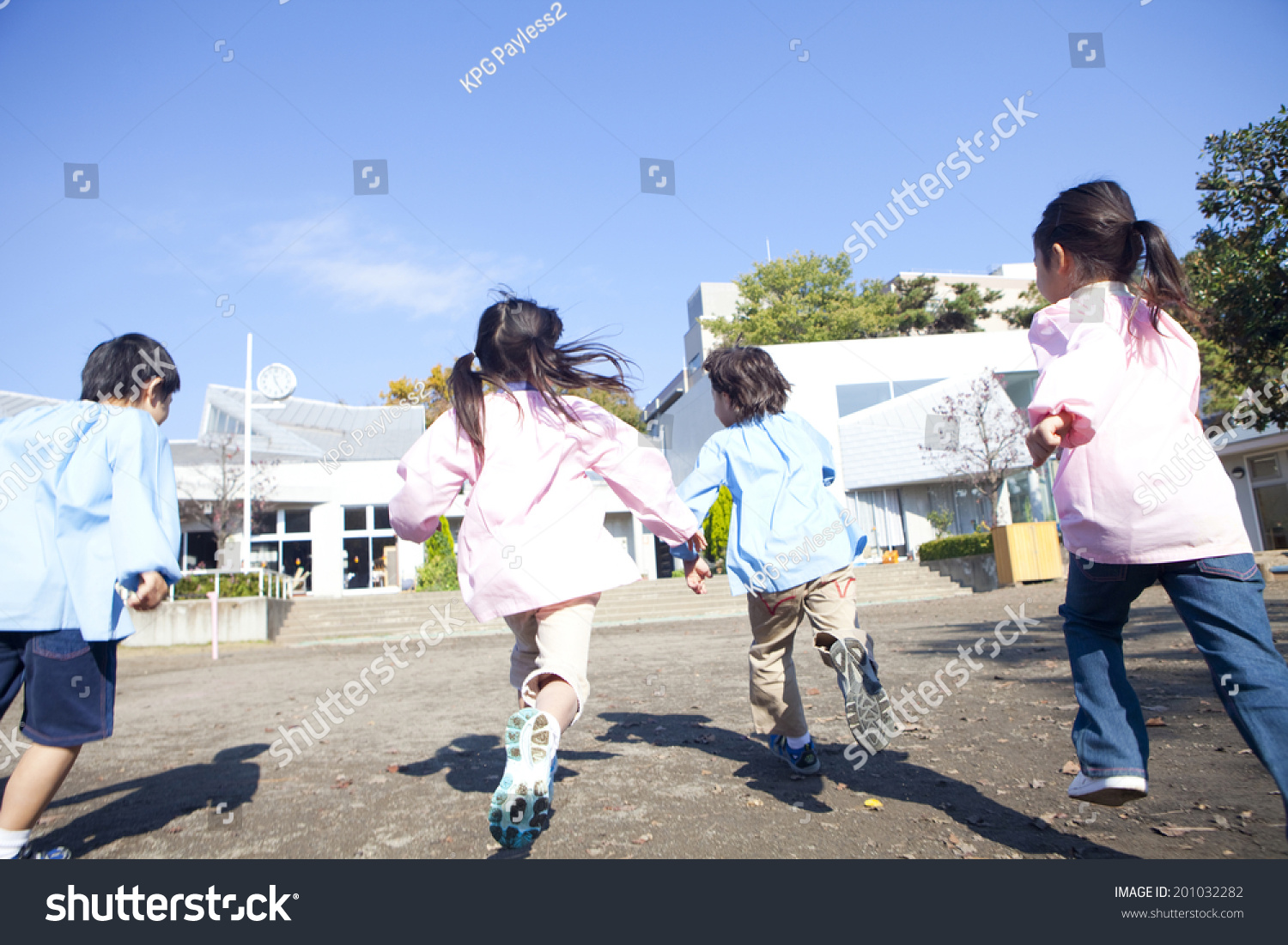 kindergarten children running in the playground