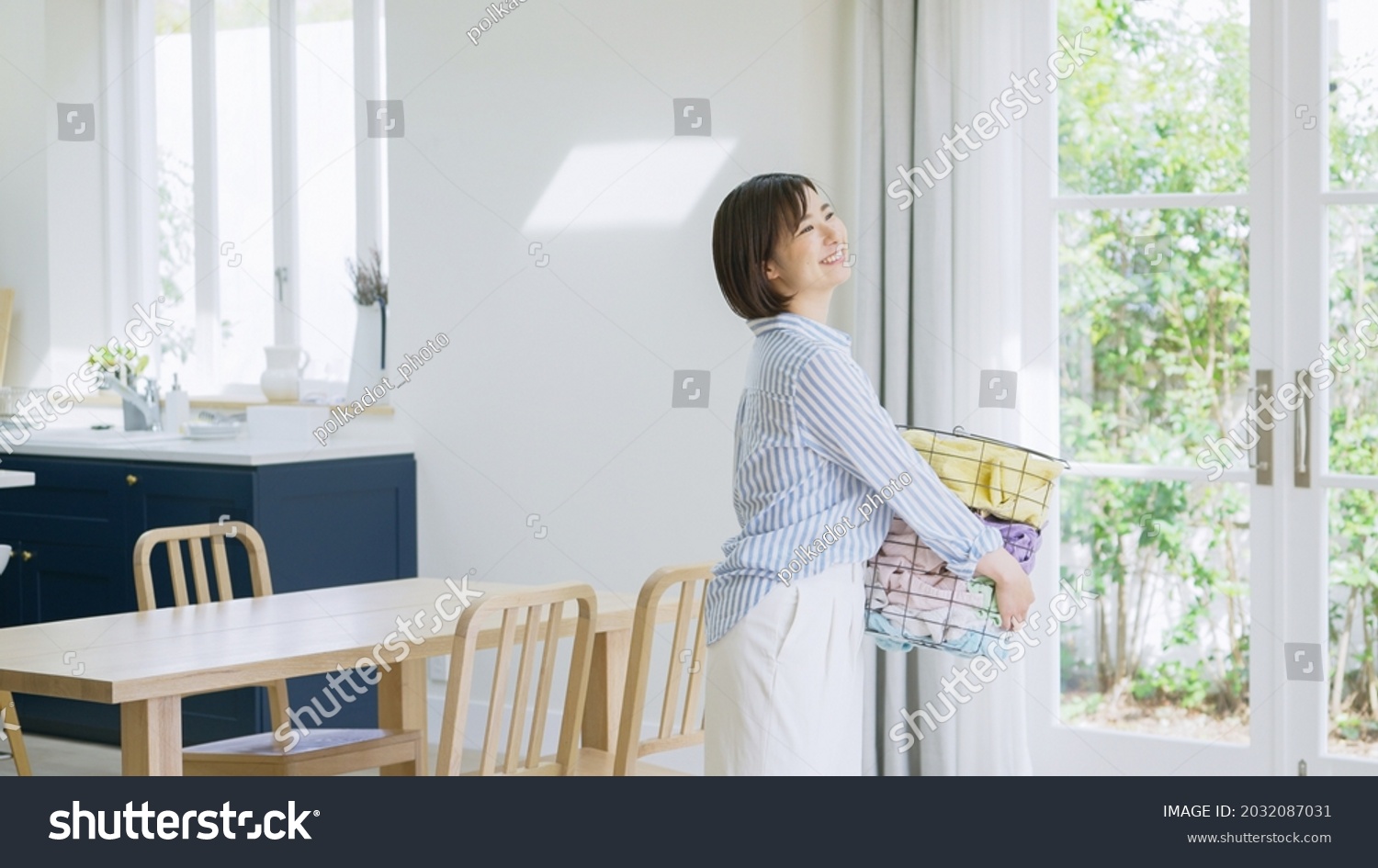 Housewife with a laundry basket
