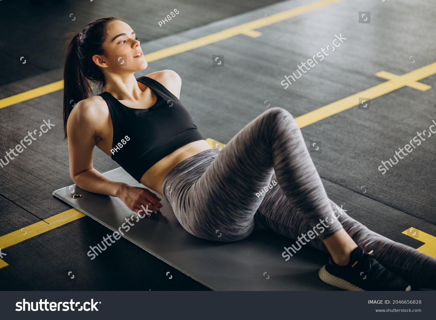 A woman exercising in a gym