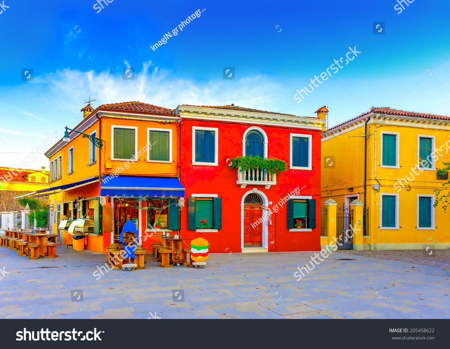 beautiful colorful small houses in a raw at Burano island near Venice Italy