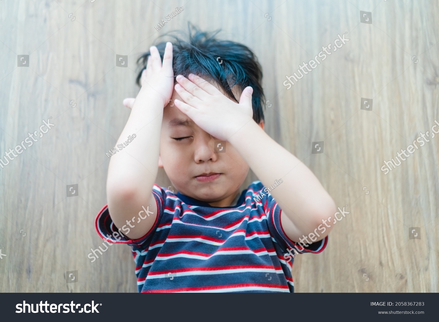 Asian kid boy headache and Accident.Foster child with bad family.Sibling rivalry fighting.School Home harassment.Accident in toddler child kid.Insurance.epilepsy child.Brain injury.emergency.first aid