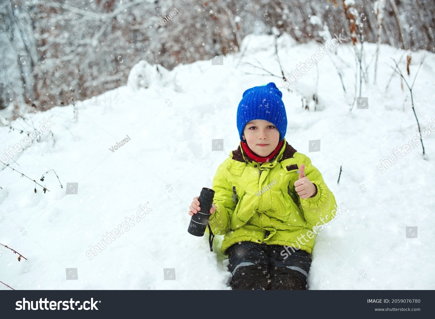 Winter fun at nature. Cute child explorer in snowy forest. Family vacation snowy day and happy childhood. Happy child walking at winter forest. Kid looking to monocular. Family winter holidays.