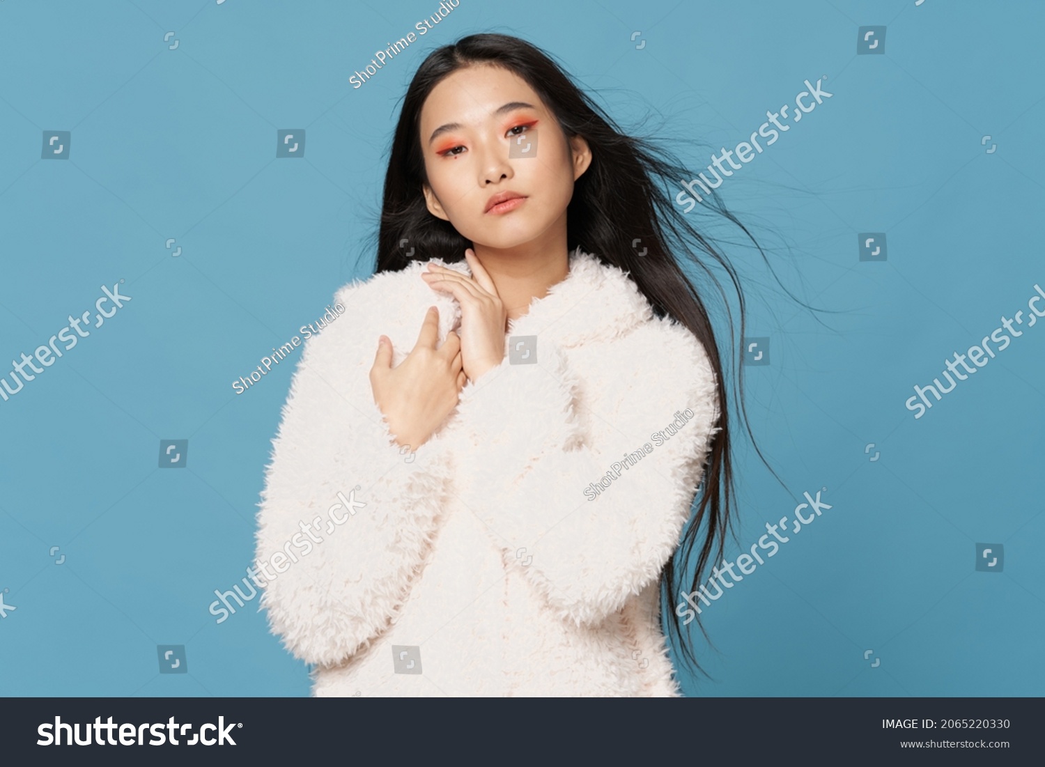 pretty woman asian appearance cosmetics on face winter clothing fashion