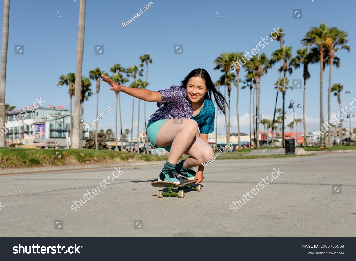 Happy girl skateboarding  fun outdoors sport activity