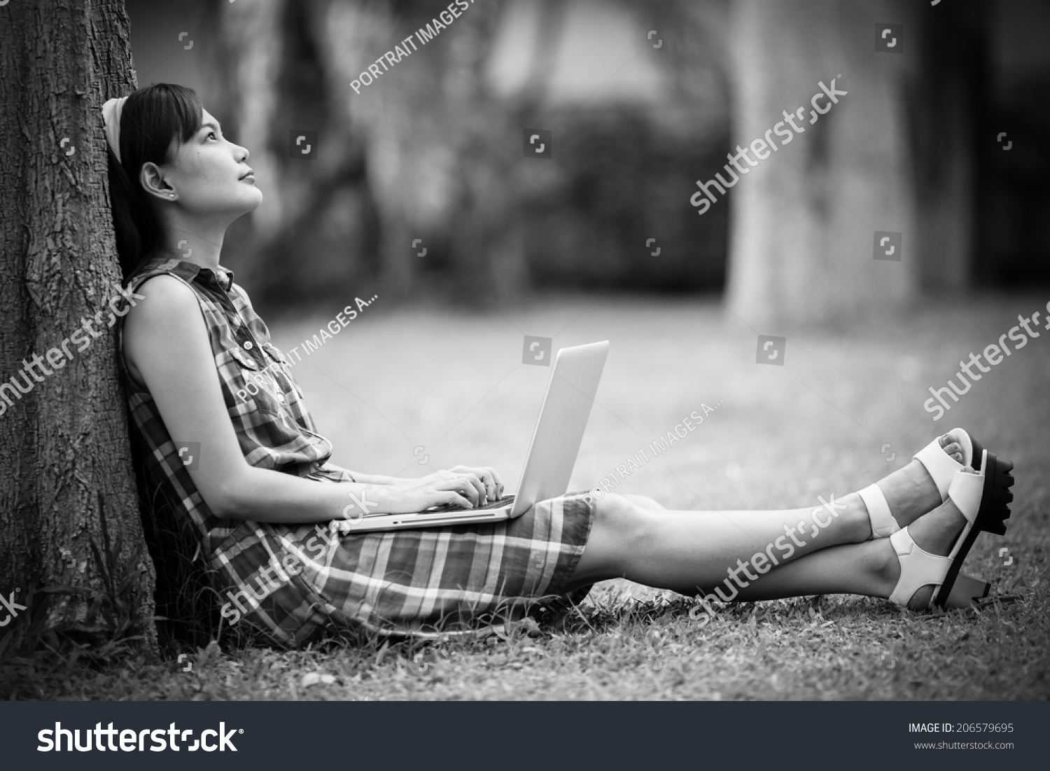 Young Caucasian woman using Laptop on nature