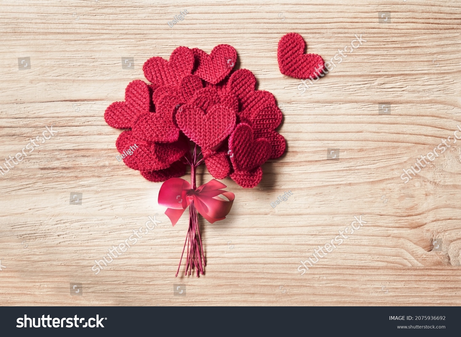 Knitted Love hearts on a wooden background  valentines day post card concept