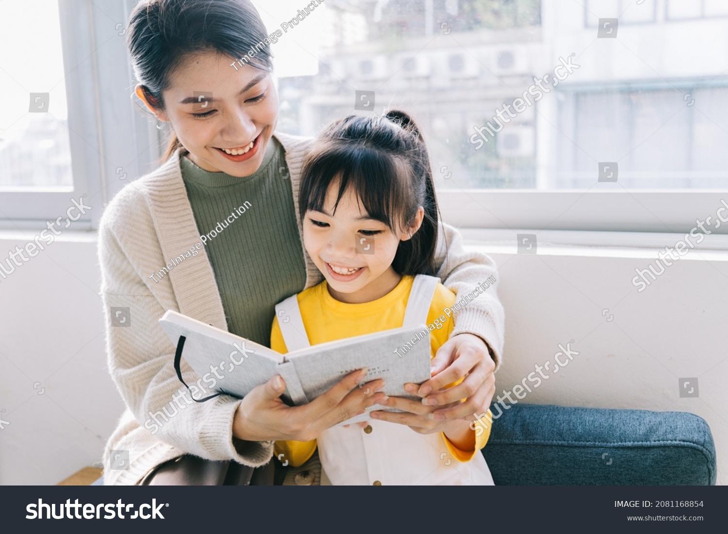 Asian mother and daughter at home together