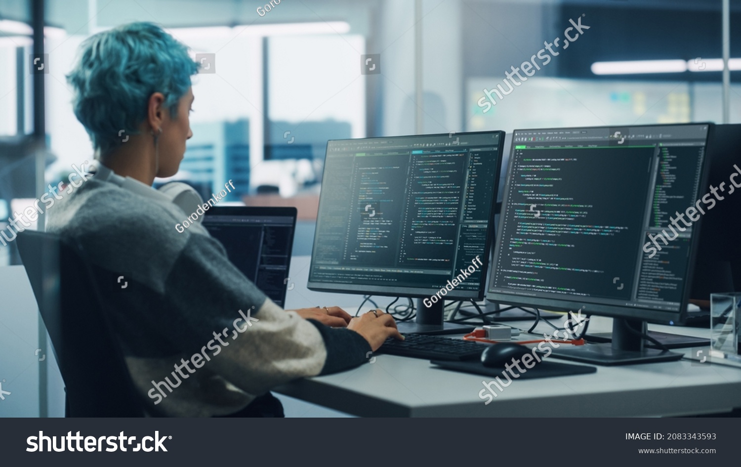 In Diverse Office: Female Programmer is Working on Desktop Computer ...