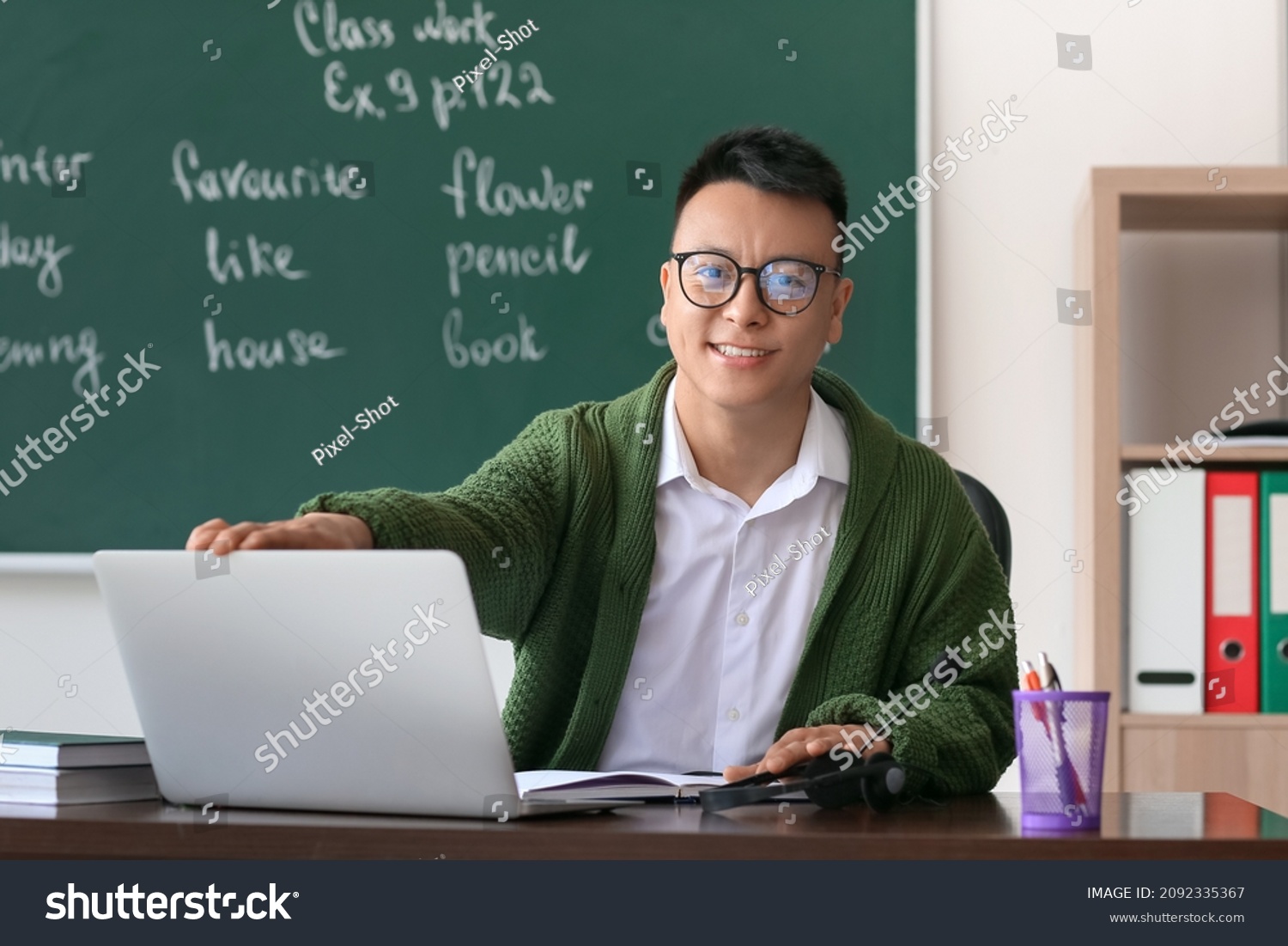 Asian teacher conducting English lesson online
