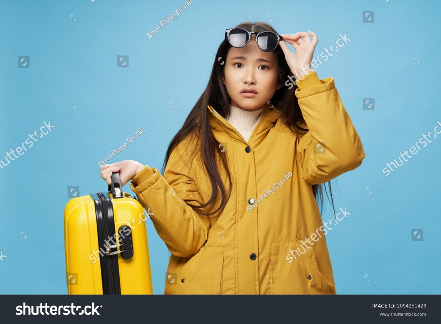 pretty woman with suitcase in winter clothes vacation travel