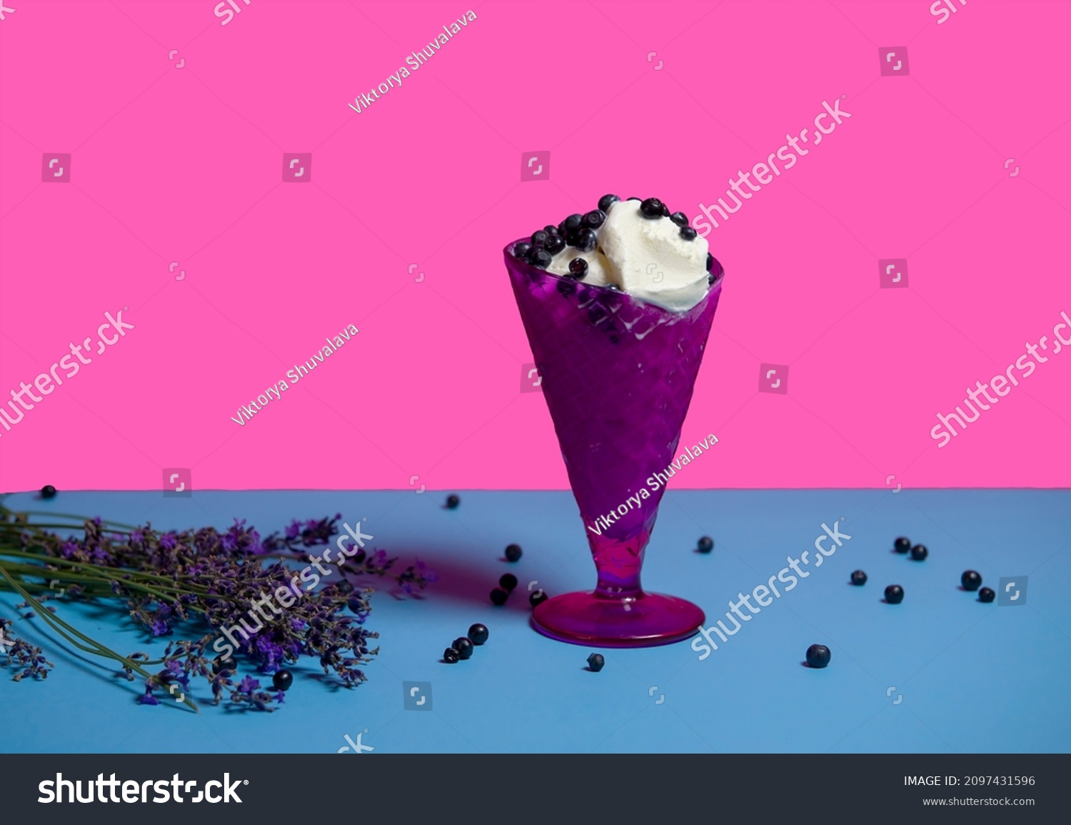 dessert of ice cream in a purple vase with fresh blueberries and lavender sprigs. Dessert for a hot party. isolated object. copy space  advertising - suitable for any field of activity. Vary Peri