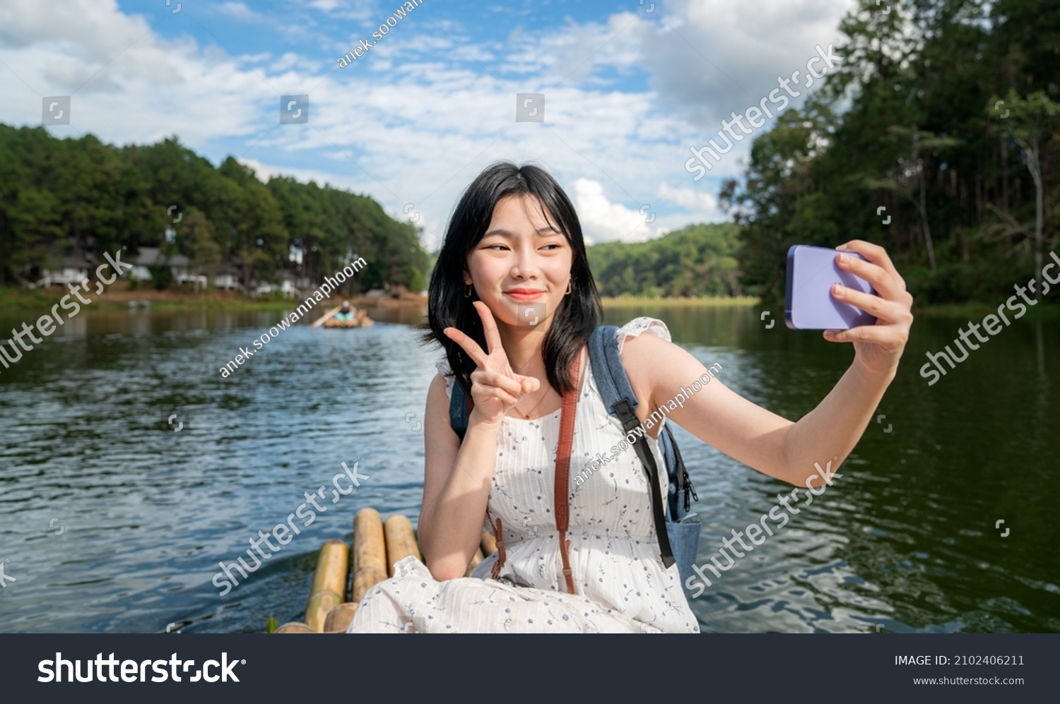 Asian traveller girl selfie on the bamboo boat at pangung Pang ung mae hong son Thailand