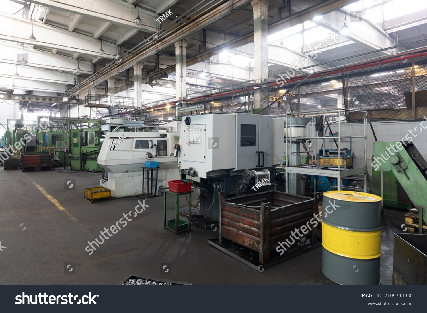 The interior of a big industrial building of factory with steel ...