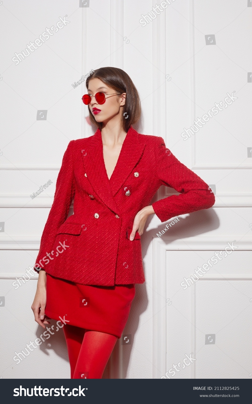 Fashion asian female model in red jacket and skirt. High fashion
