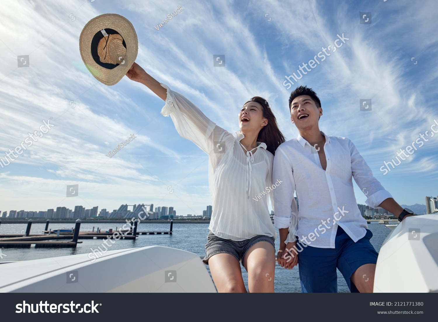 Romantic young couples aboard a yacht out to sea