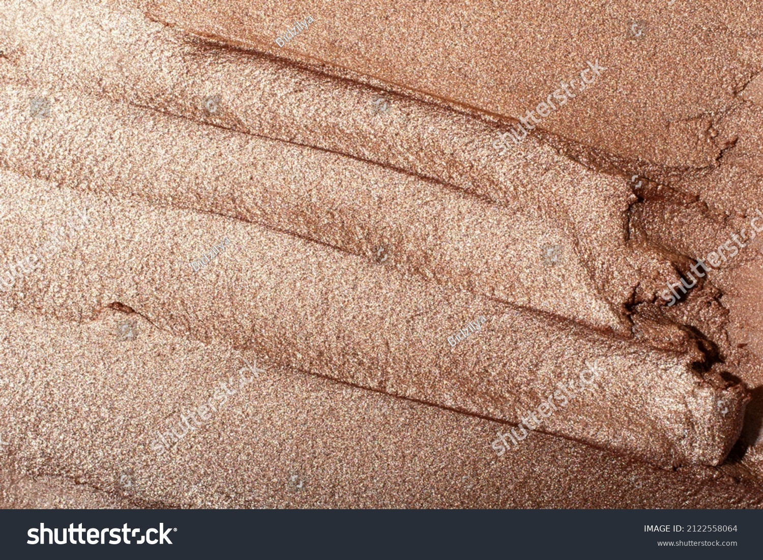 Macro photography of the cosmetic highlighter with shimmer.
