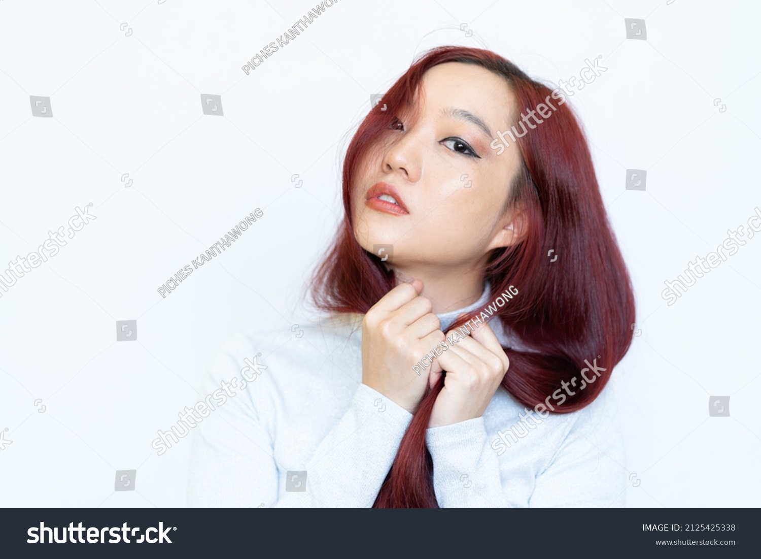 portrait of a beautiful young woman with bright makeup red hair isolate on white background