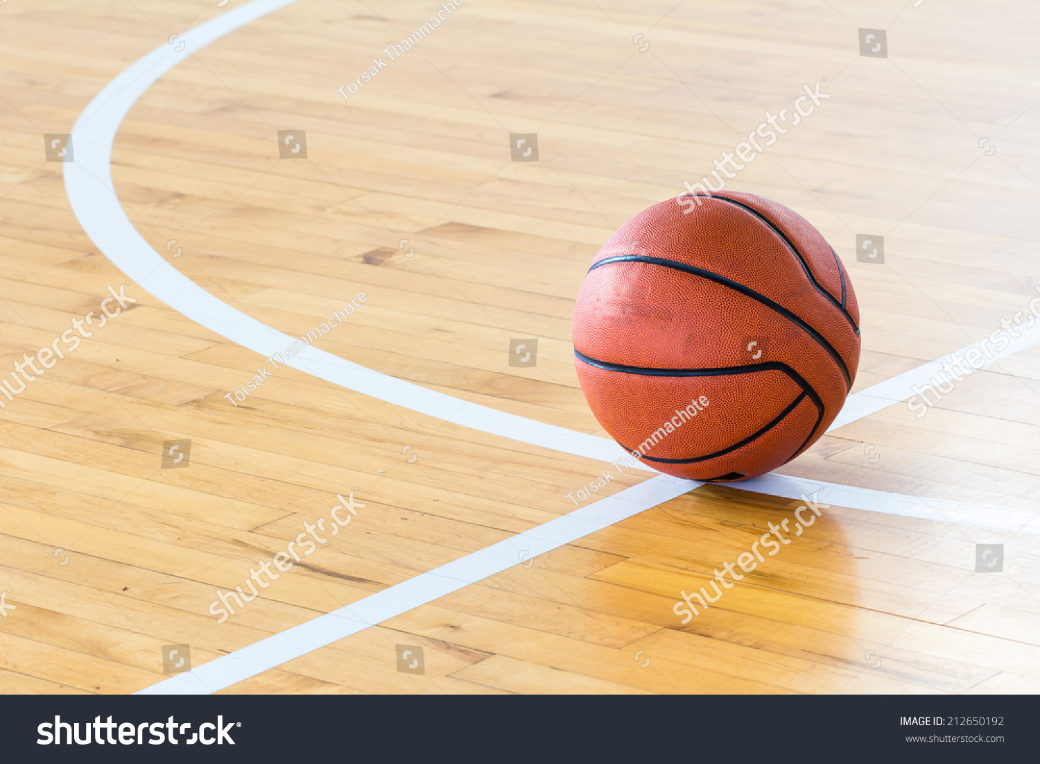 Basketball ball over floor in the gym 