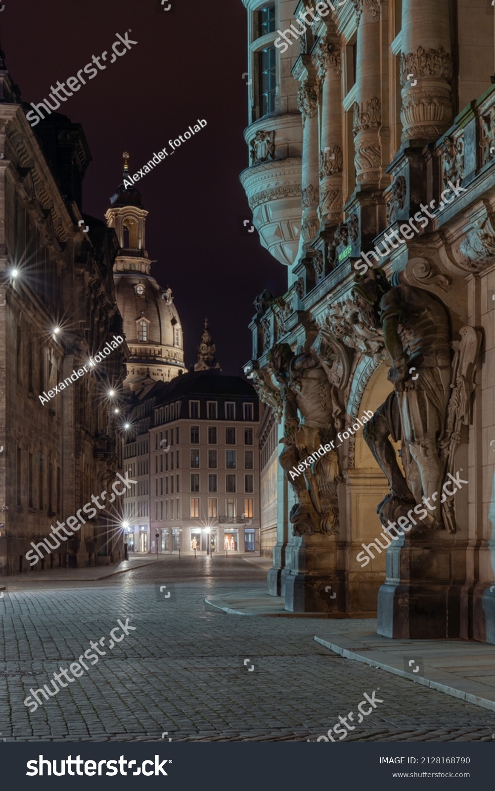 Dresden renaissance palace and view at the end of the street on the Frauenkirche