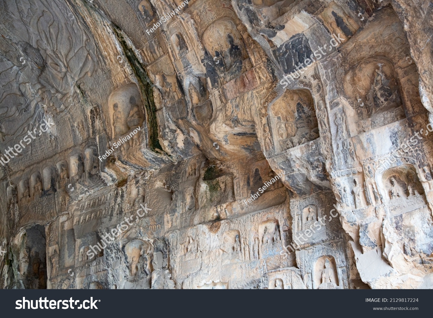 Famous Longmen Grottoes (statues of Buddha and Bodhisattvas carved in the monolith rock near Luoyang in Hennn province  China)