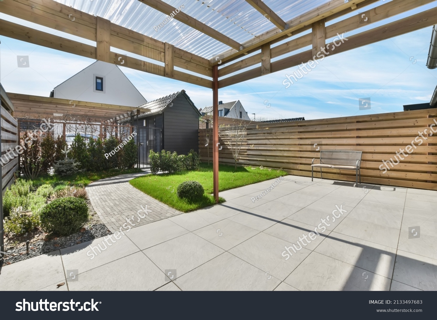 Cozy patio in the backyard of the house in pastel colors. garden with