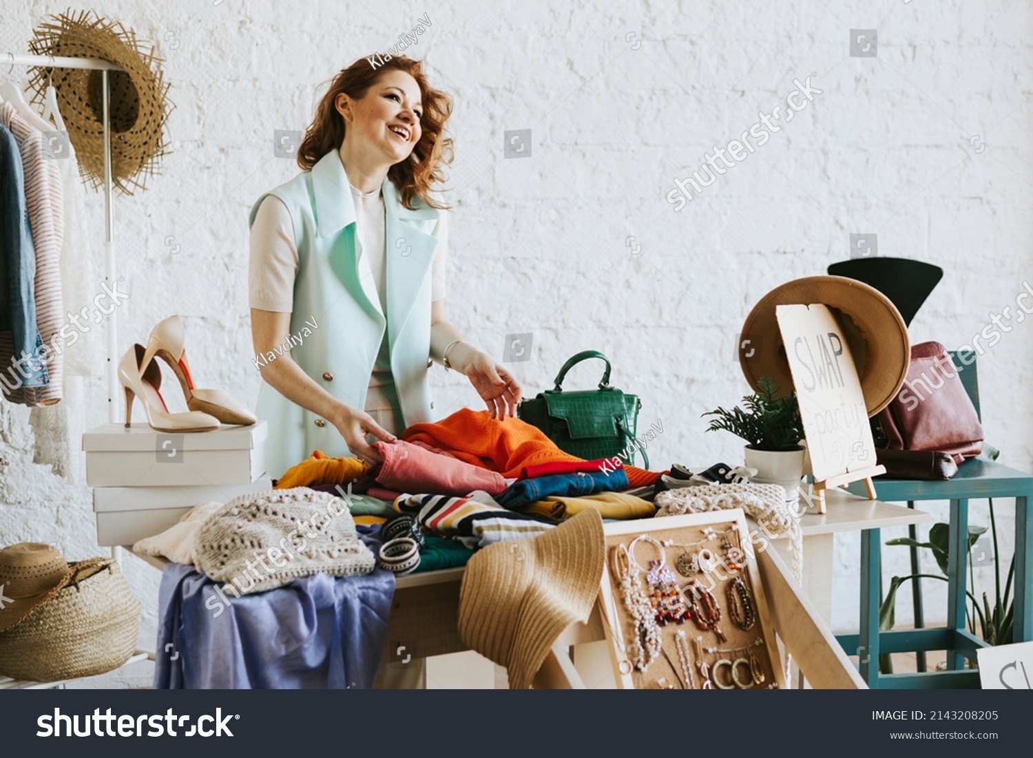 middle aged woman female woman at swap party try on clothes bags shoes and accessories change clothes second hand garment zero waste life eco-friendly approach to consumption diverse people