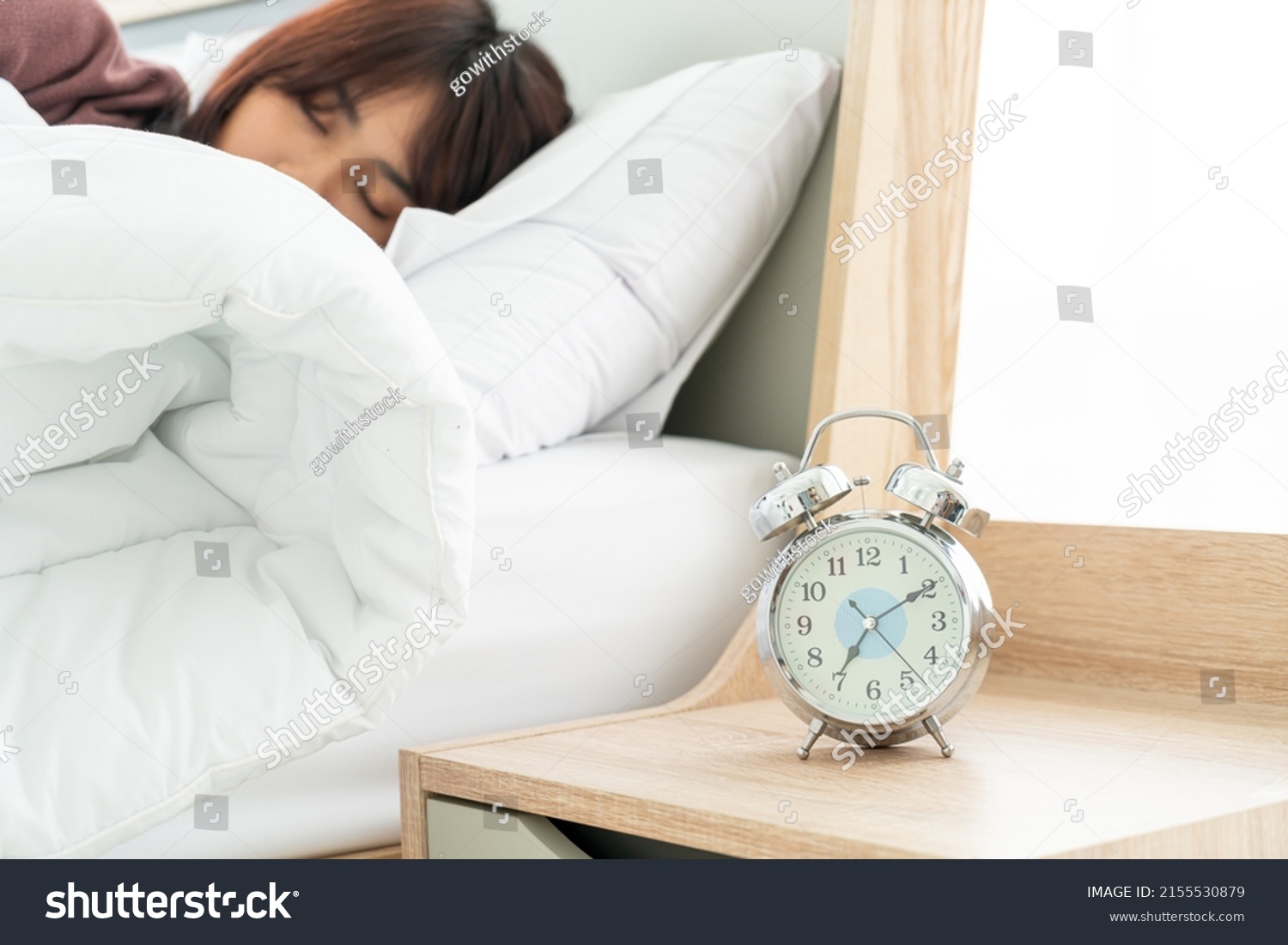 beautiful Asian women on bed and waking up in the morning