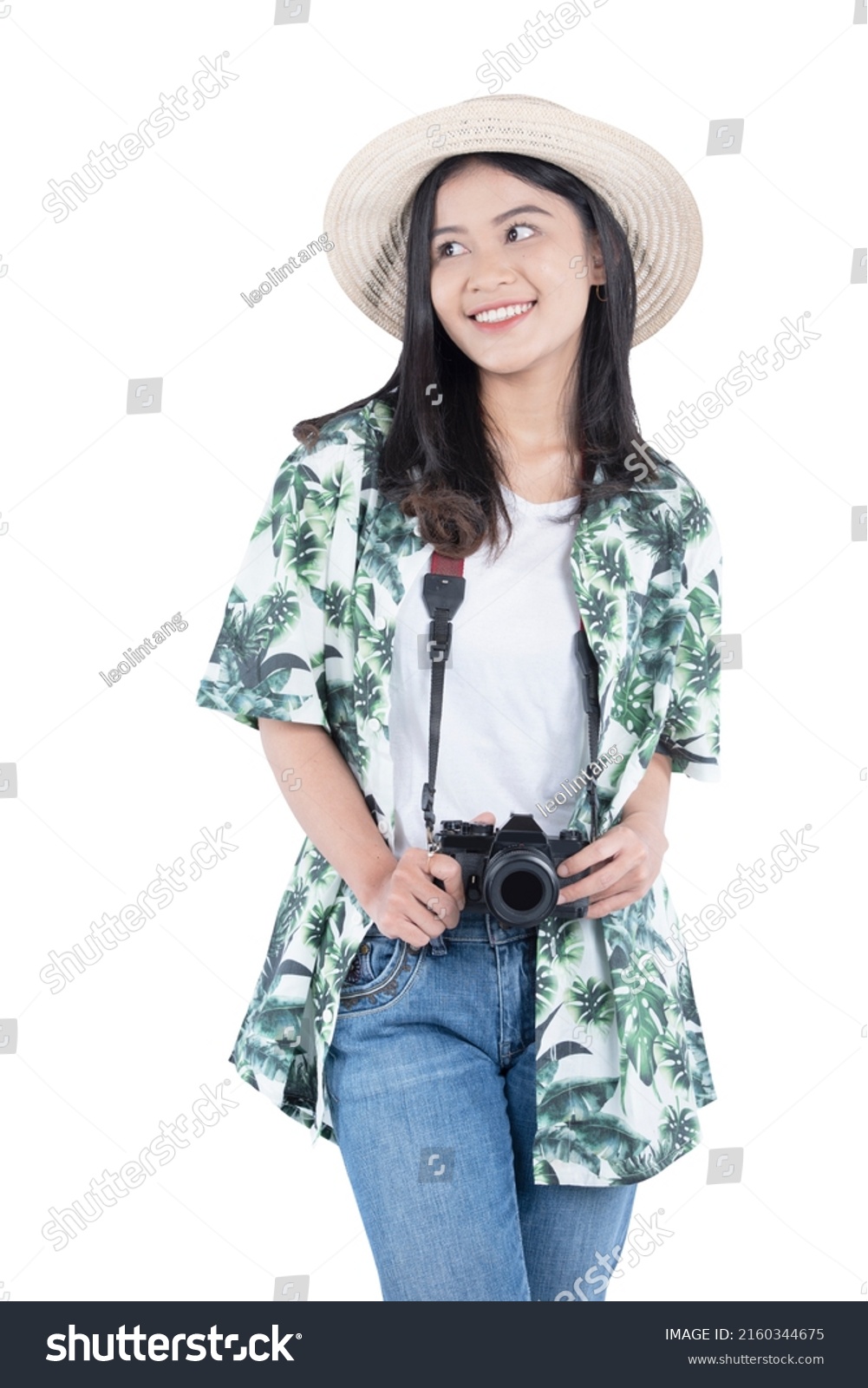 Asian woman with hat and camera standing isolated over white background