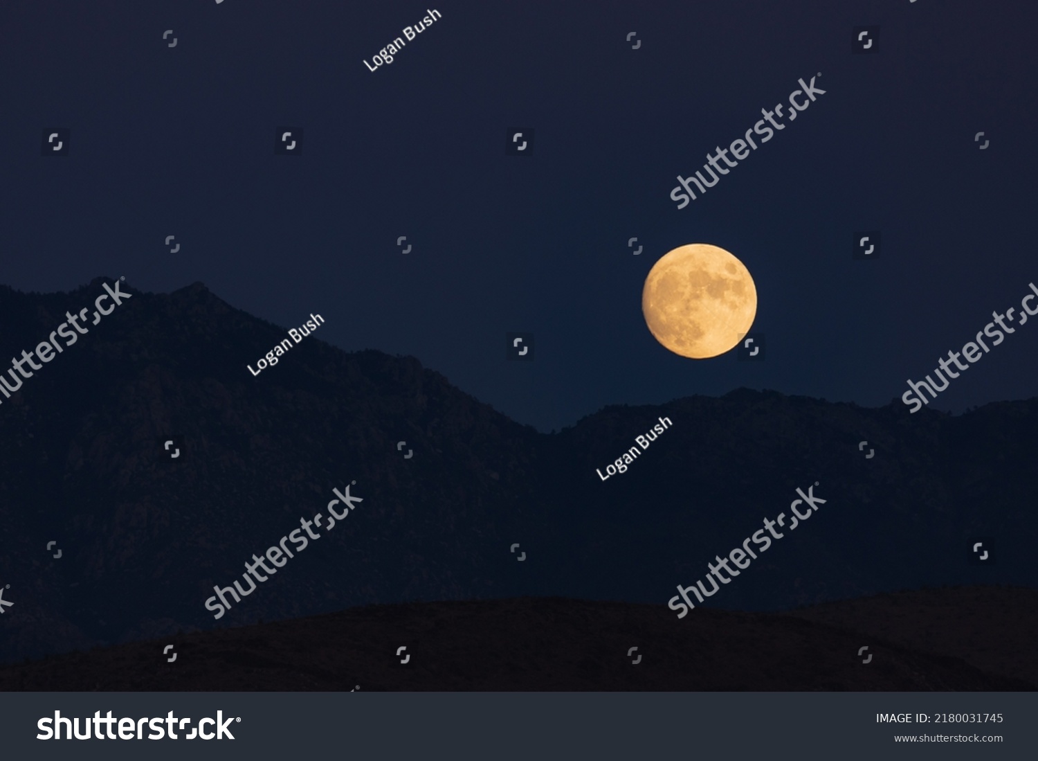 The moon rises above Kingman  Arizona.