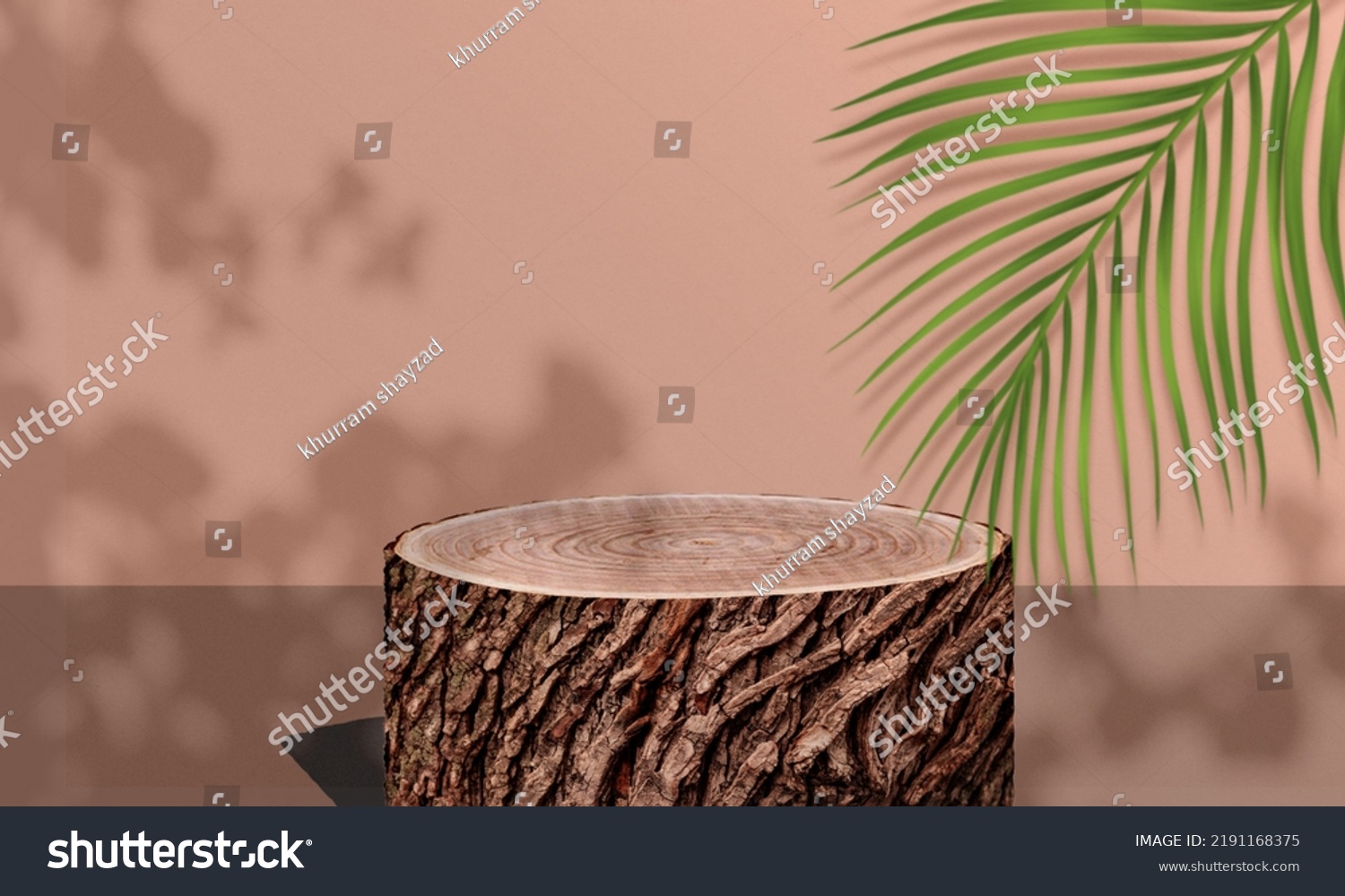 round wooden tree trunk podium for product display with palm leaves and tree shadows