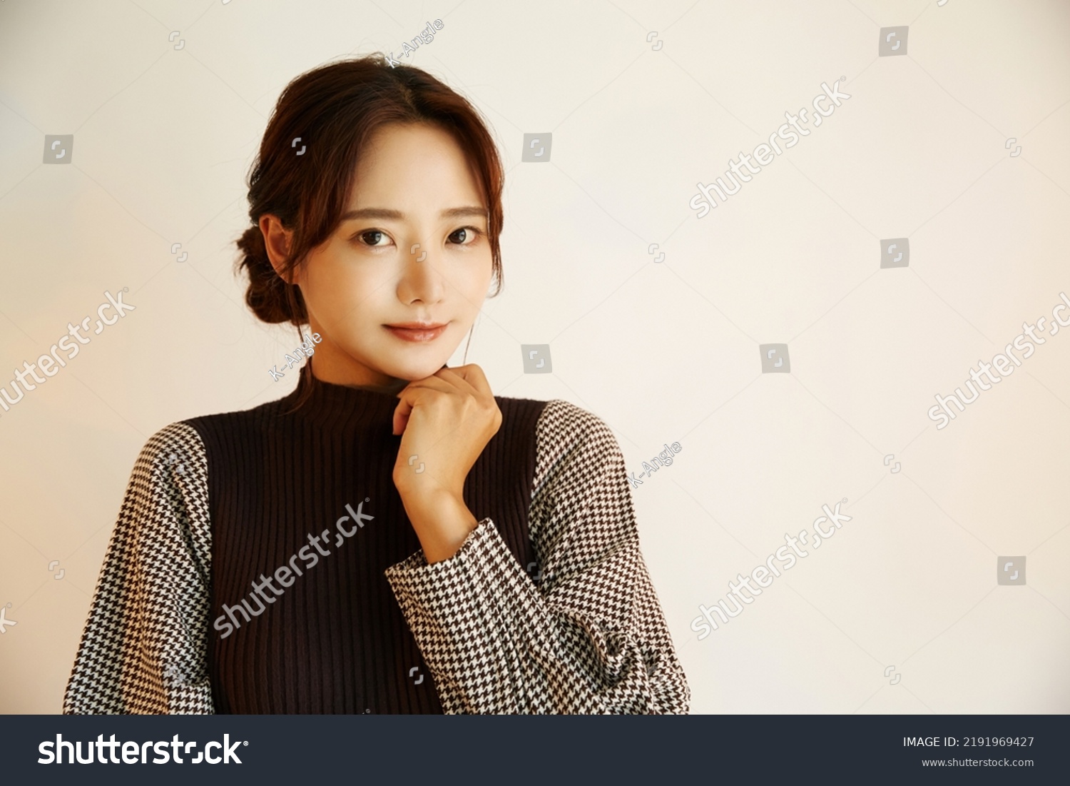 Portrait of a young Asian woman in autumn fashion