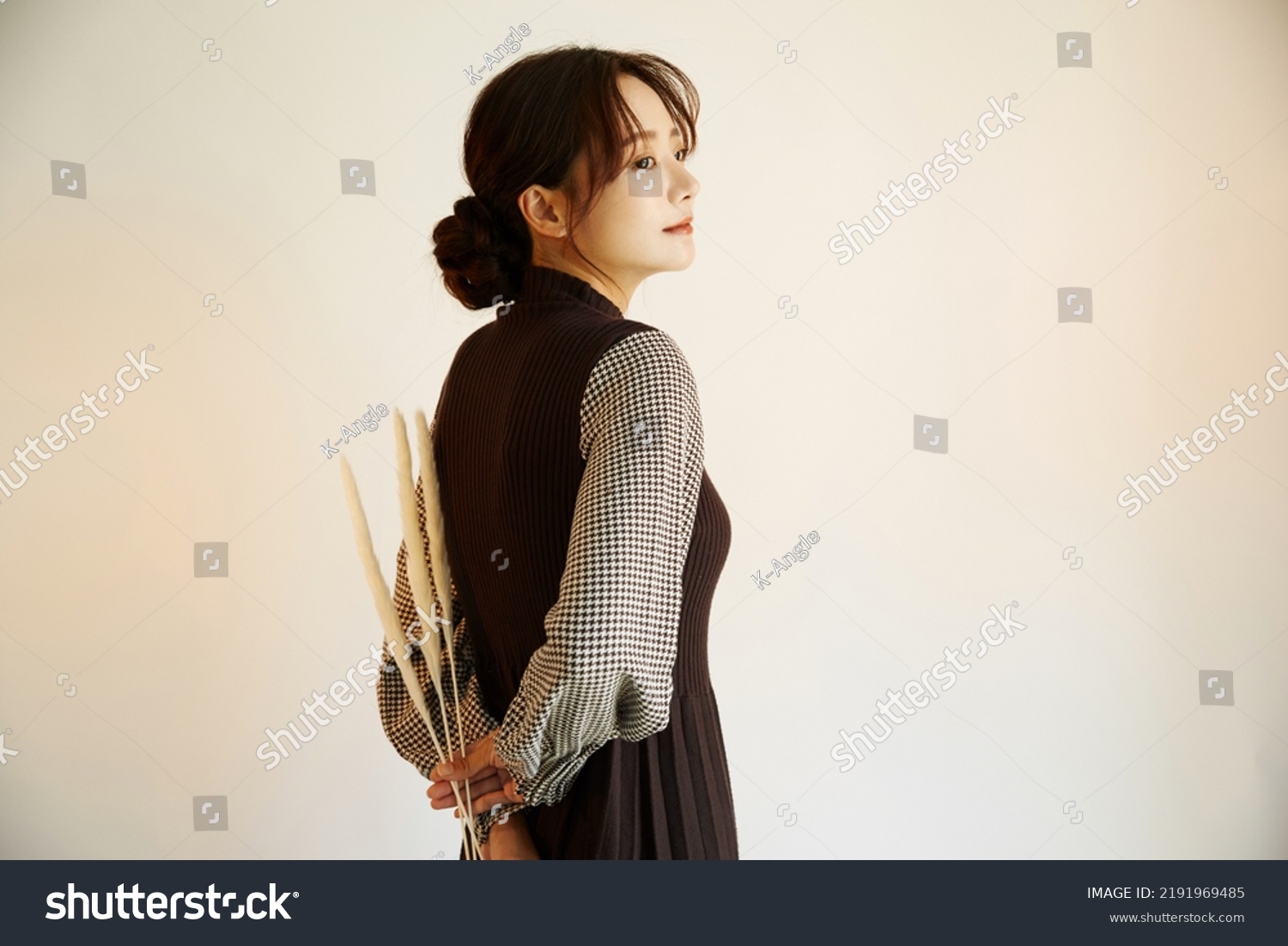 Portrait of a young Asian woman in autumn fashion