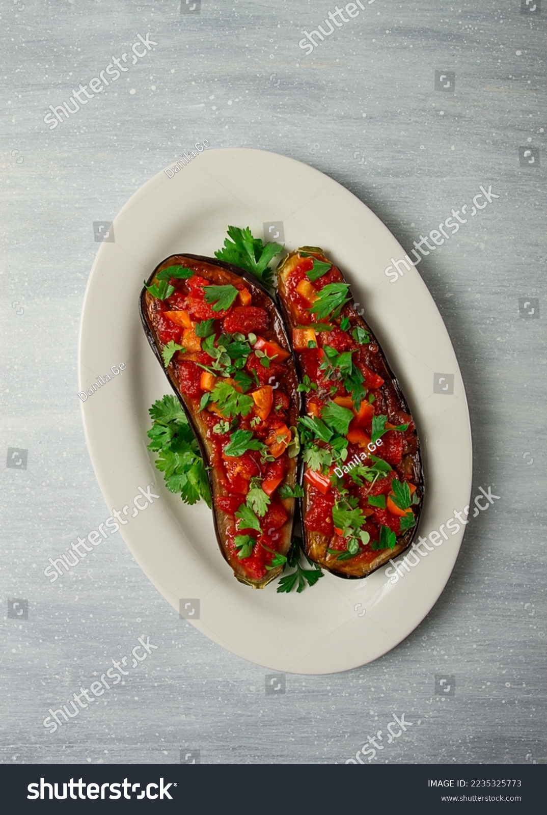 Traditional Turkish dish Imam Bayildi stuffed eggplant with tomatoes ...