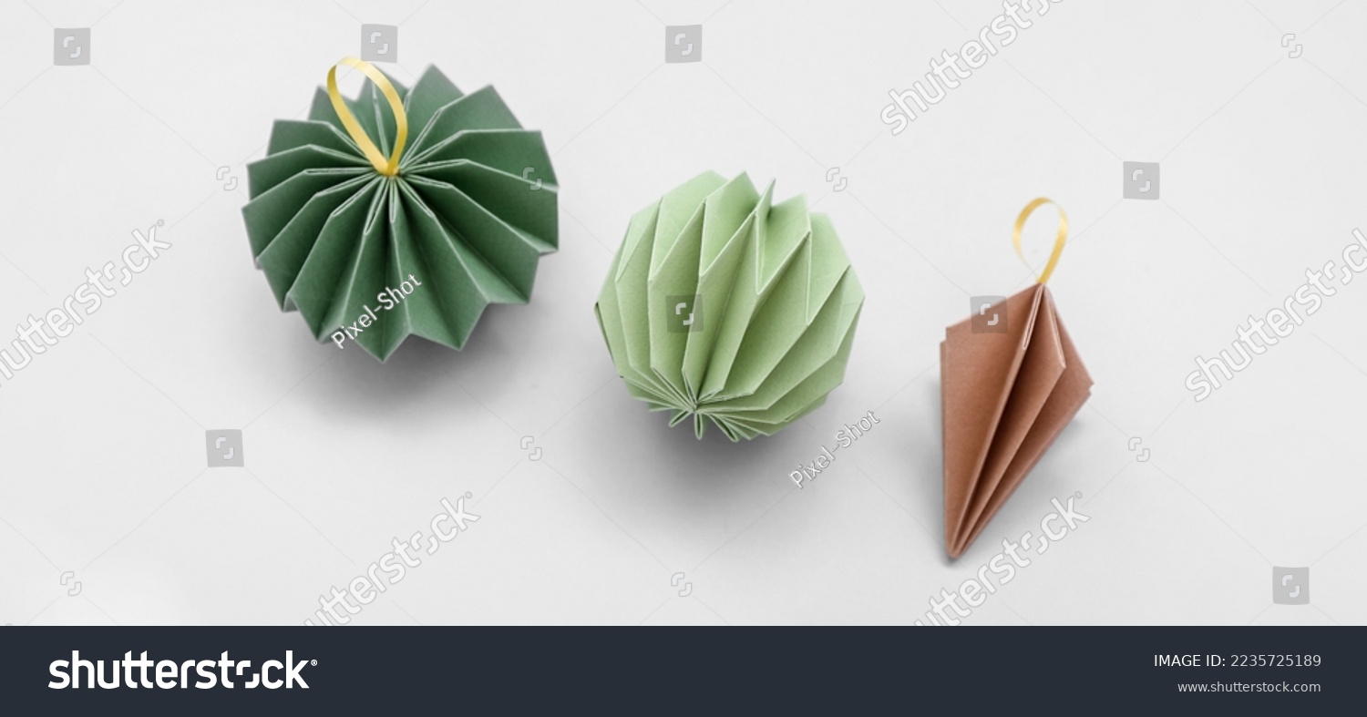 Paper Christmas decorations on white background