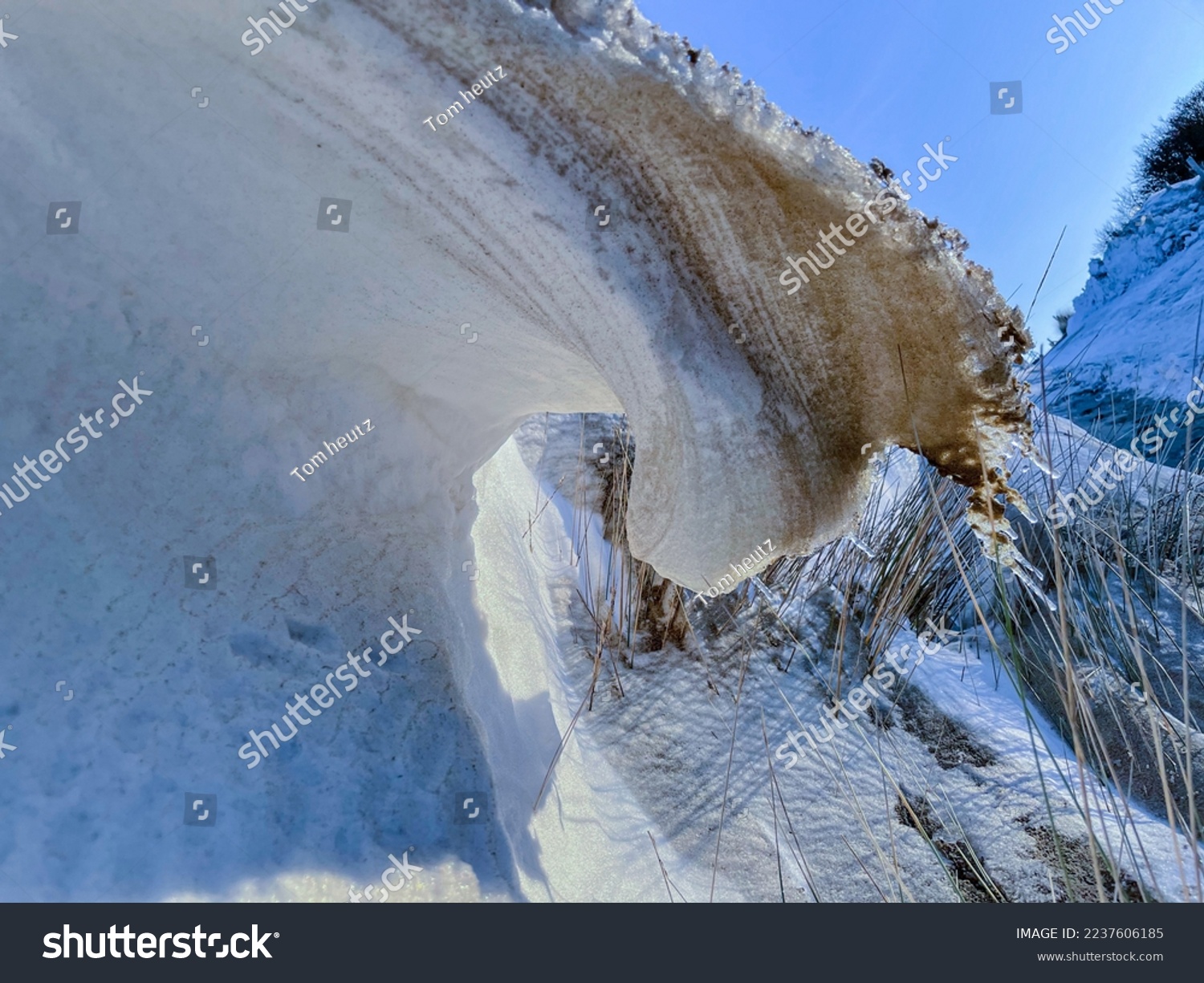 Picture has been made at the beach. Frozen sand with a bow