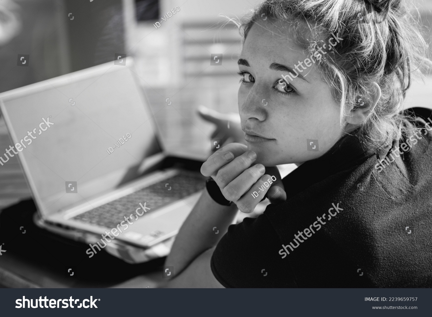 Beautiful young woman working on a laptop