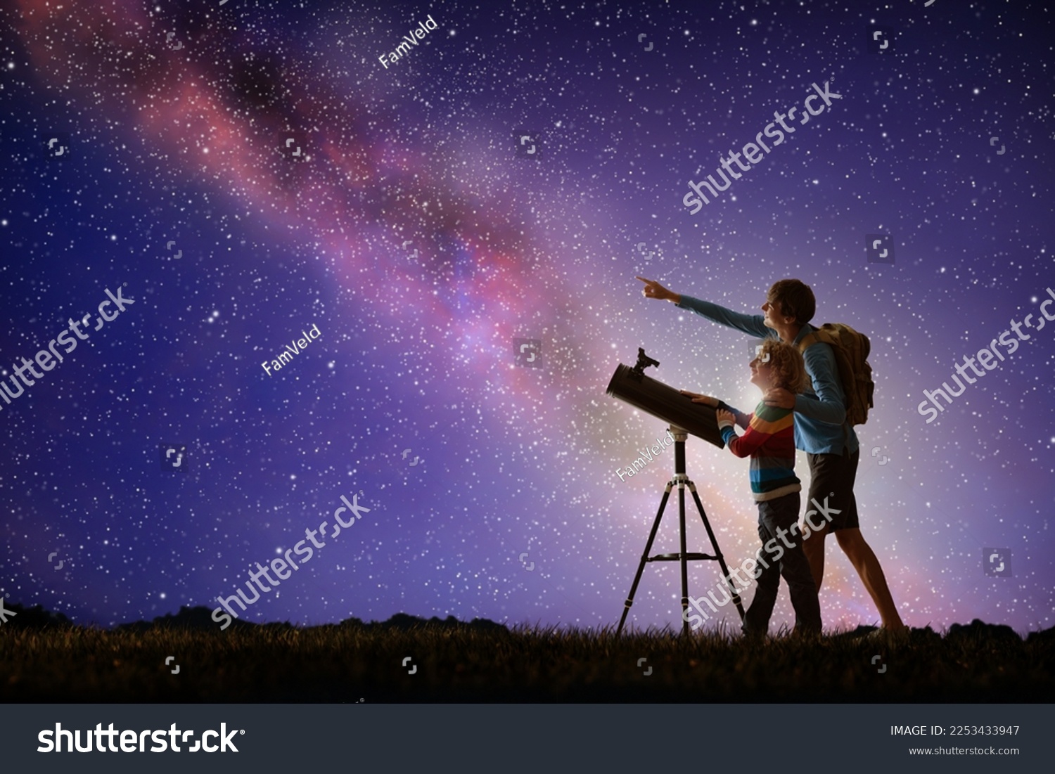Man and child looking at stars through telescope. Family camping and ...