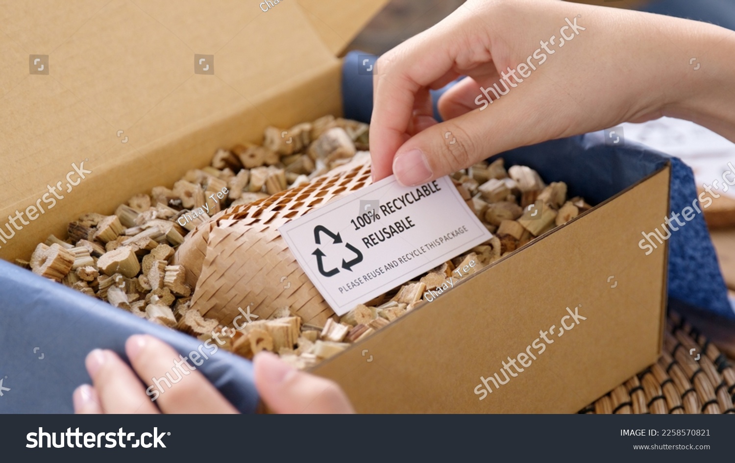 Eco vendor go green packaging parcel carton box in net zero waste store asian seller retail shop. Earth care day small SME owner asia people wrap reuse brown paper pack gift reduce plastic free order.