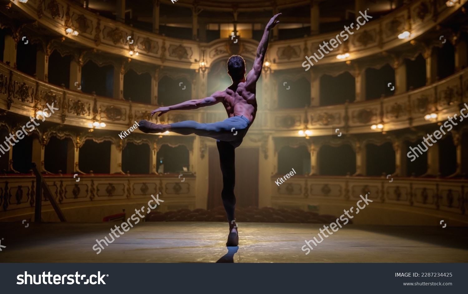 Back View Cinematic Shot of Athletic Man Dancing and Rehearsing on ...