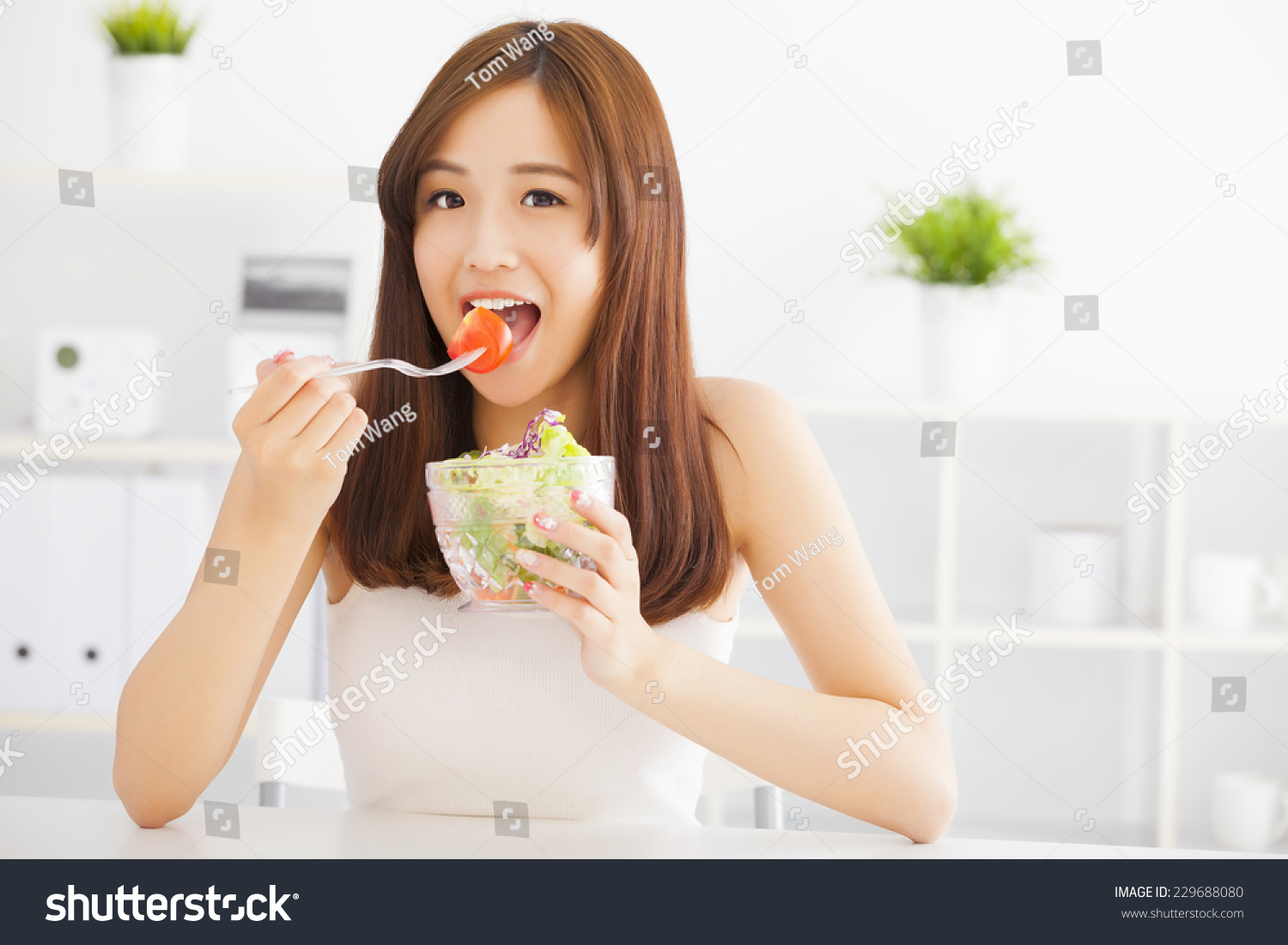 beautiful asian young woman eating healthy food