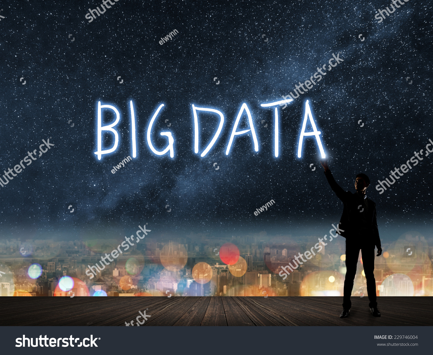 Concept of   Asian young man standing on roof and drawing by flash light.