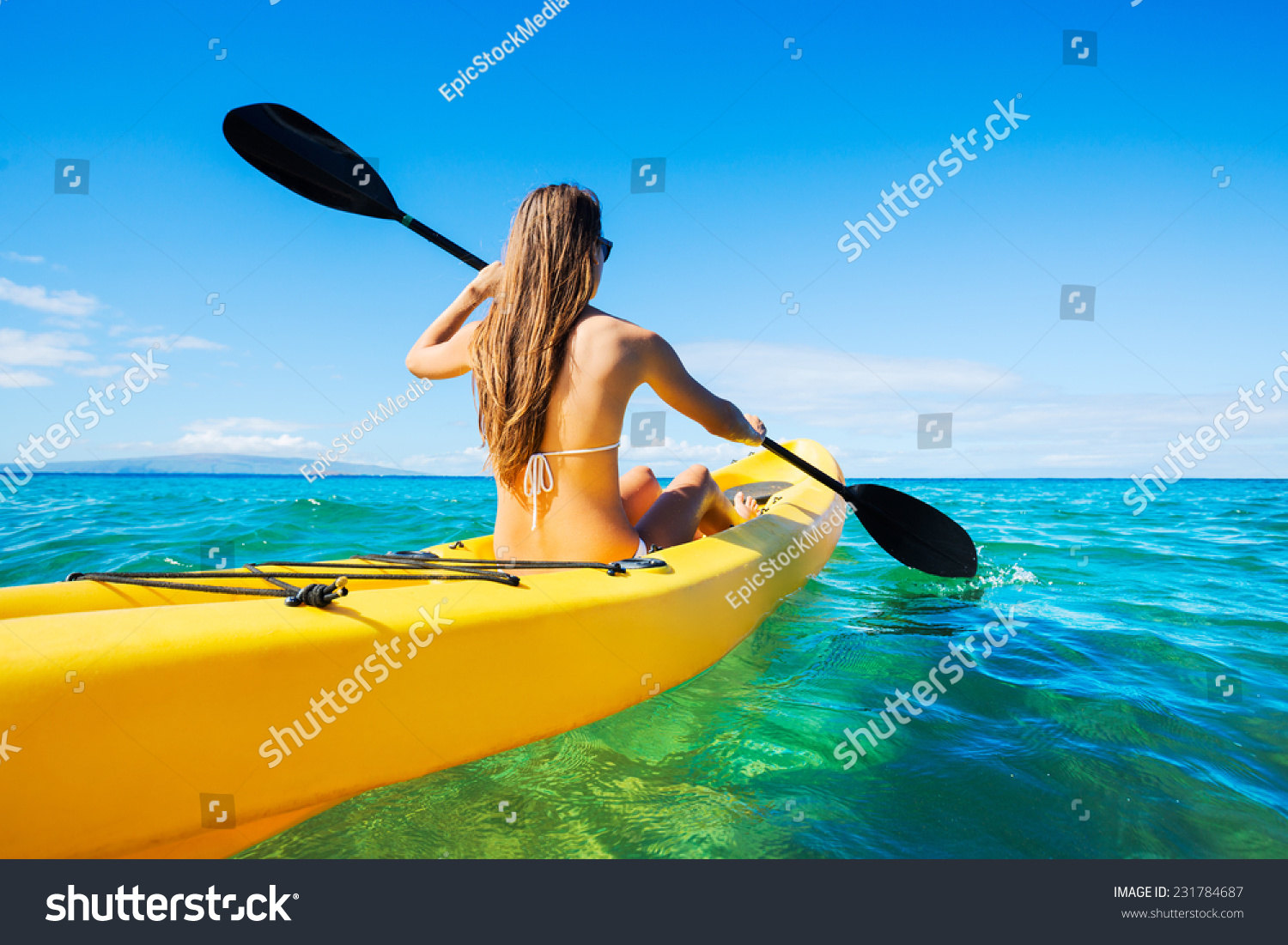 Woman Kayaking in the Ocean on Vacation in Hawaii