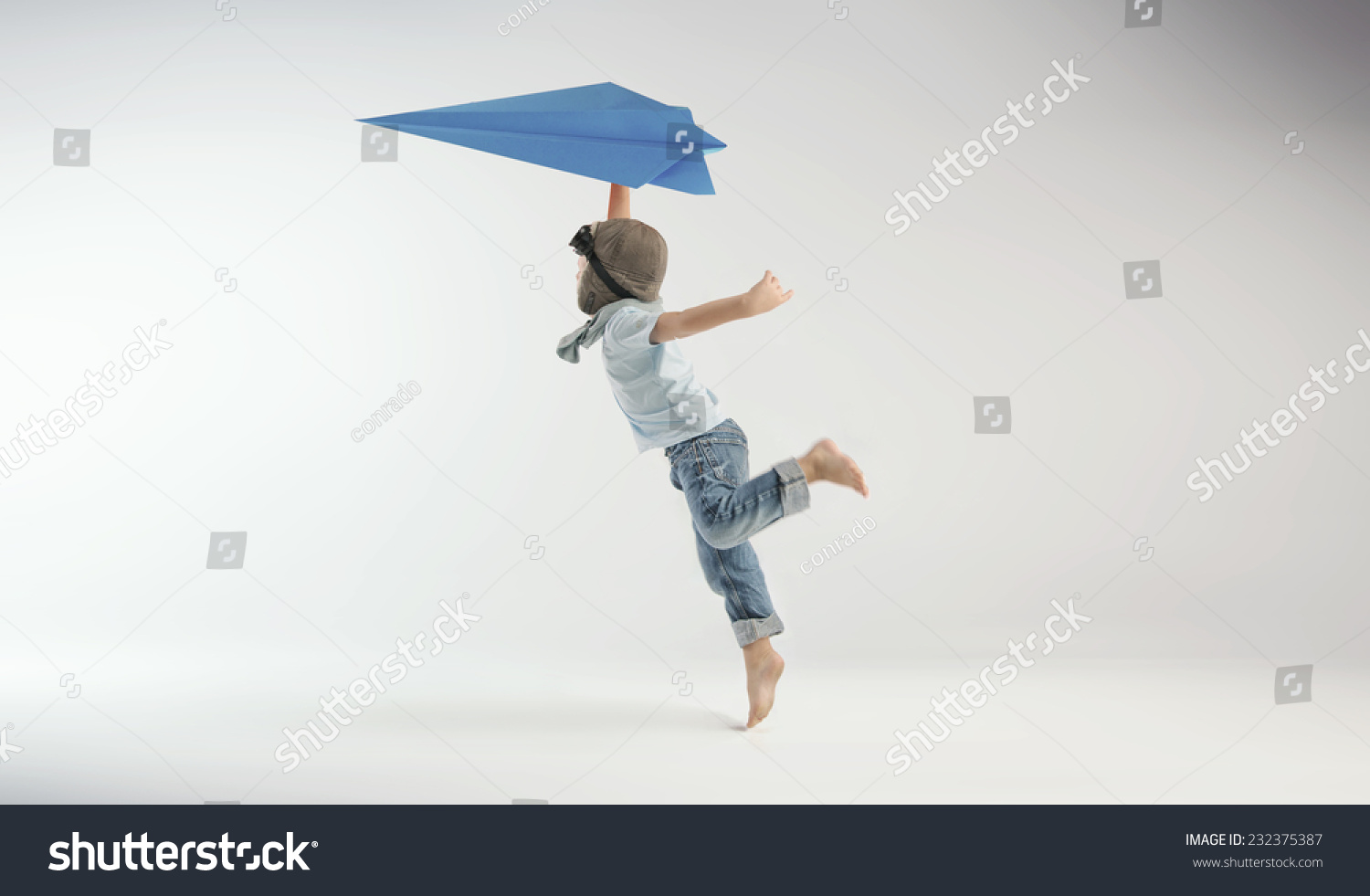 Happy kid playing with toy airplane