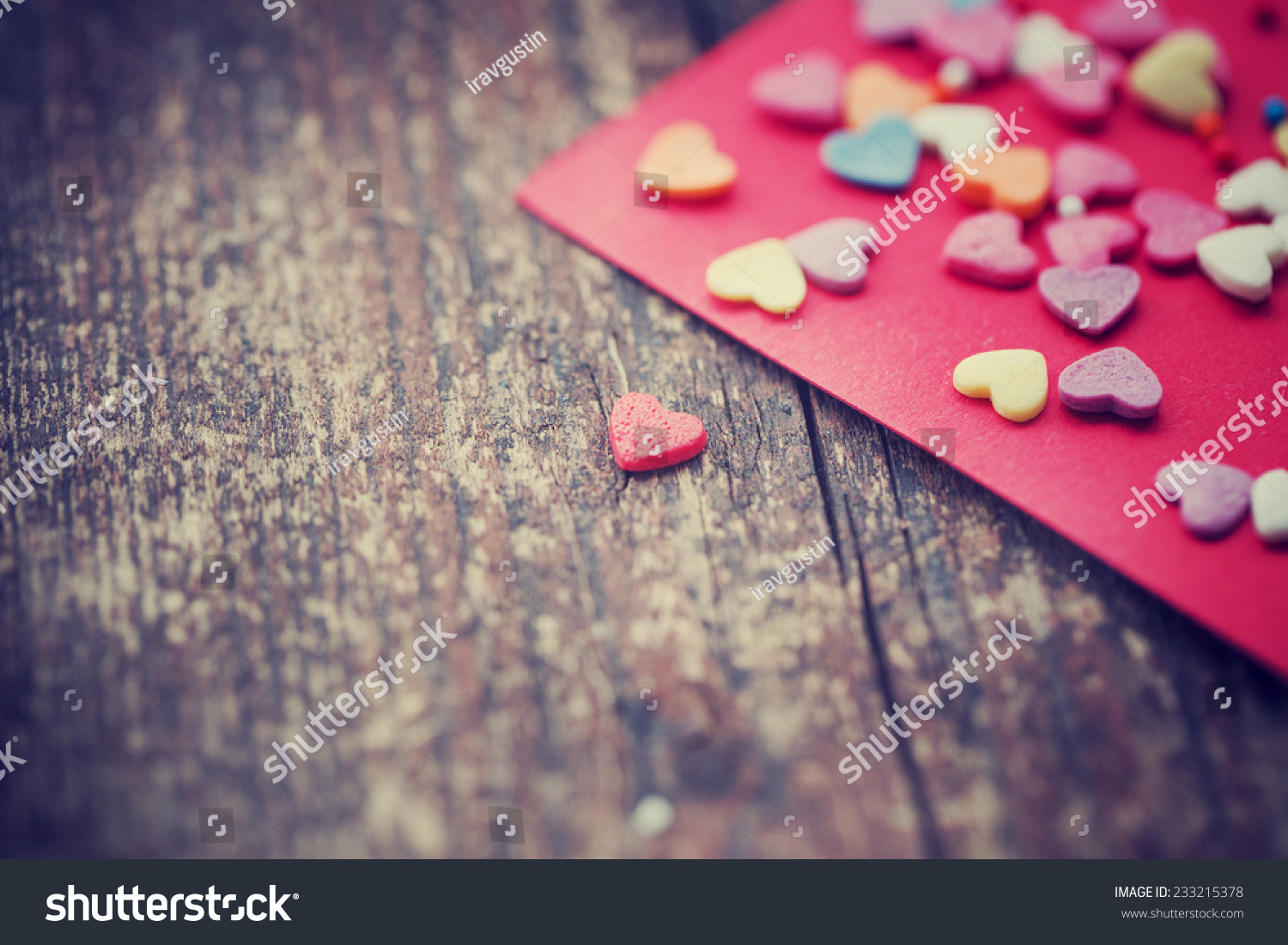 Valentine's day card with small hearts on wooden background/ romantic love background
