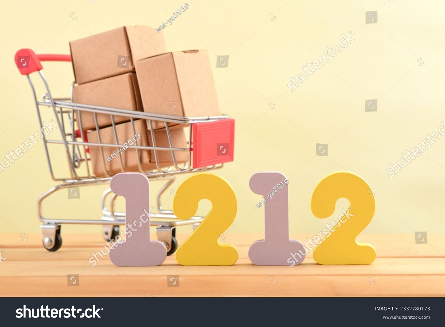 Double twelve numbers and a shopping cart filled with delivery boxes