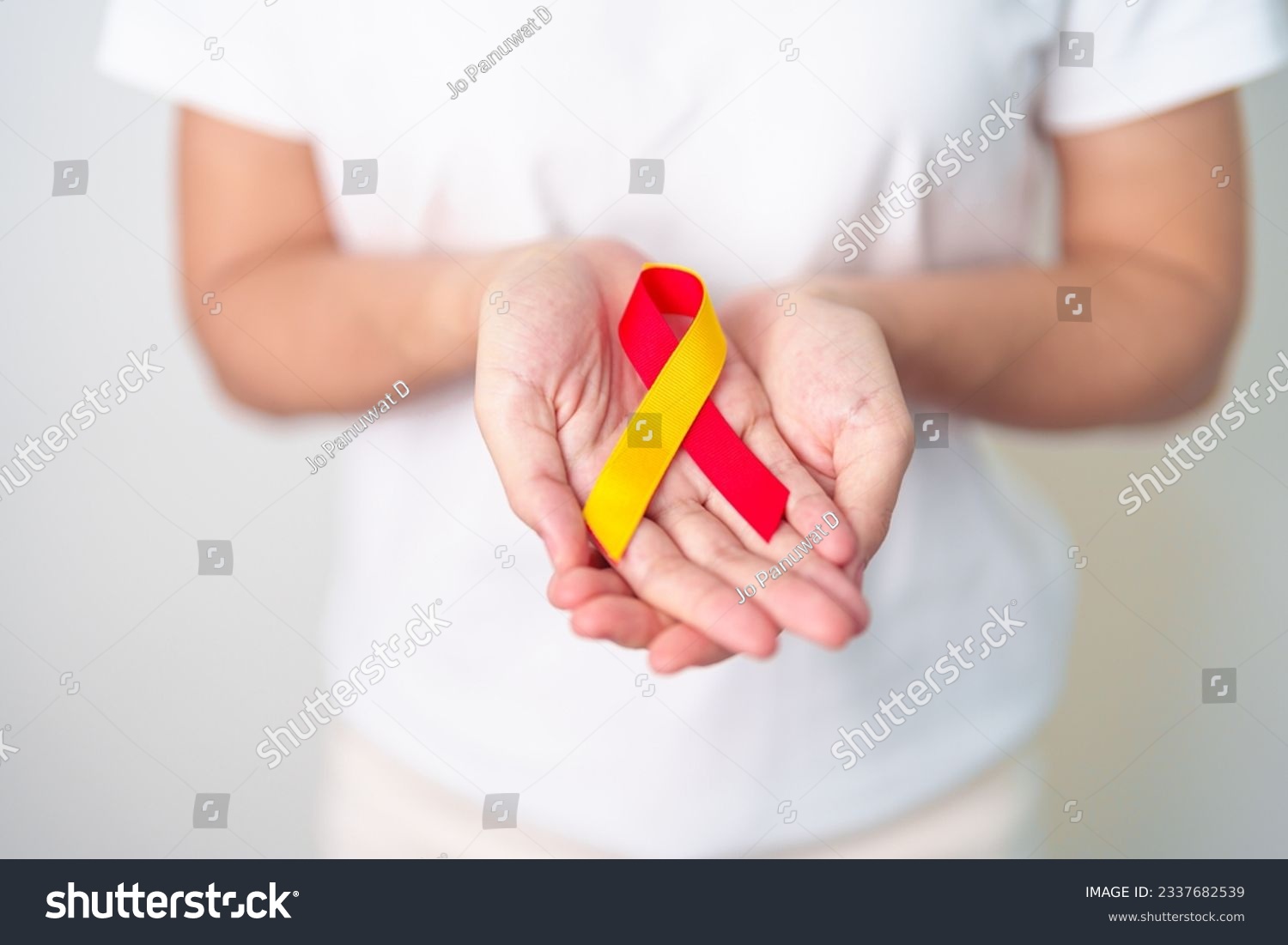 woman holding Red and Yellow ribbon. World hepatitis day awareness month 28 July Liver cancer Jaundice Cirrhosis Failure Enlarged Hepatic Encephalopathy and Health concept