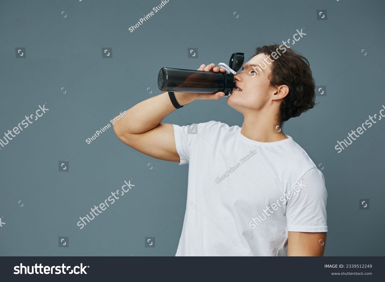 isolated man guy athletic fit t-shirt bottle exercise drink water sport